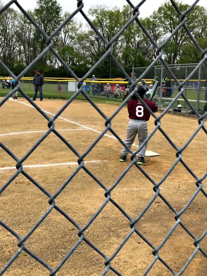 tball at bat being pitched to