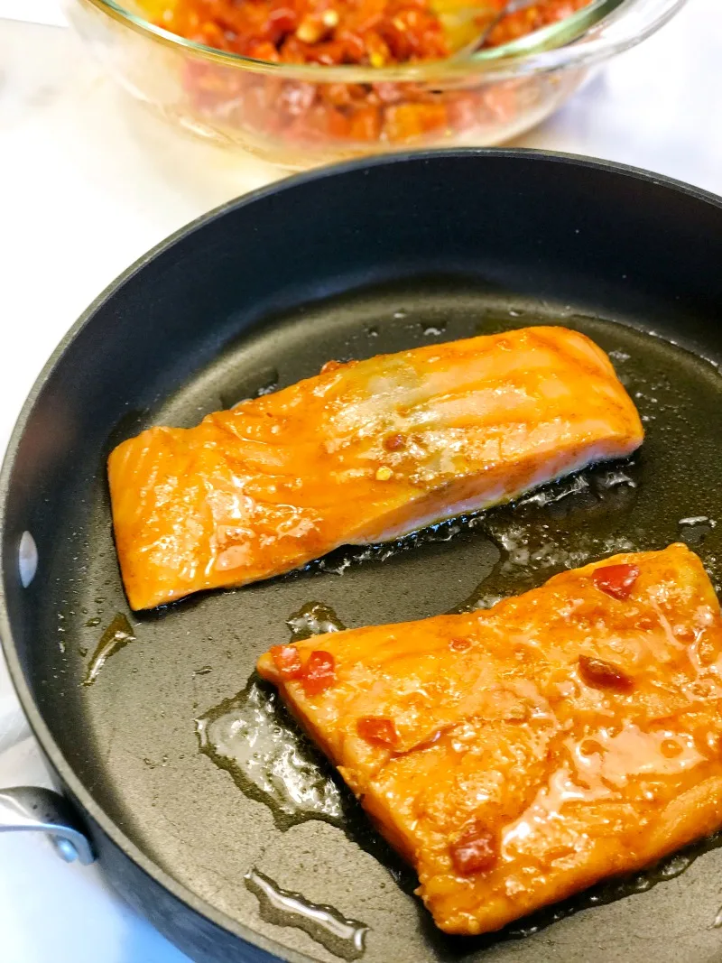 Kroger Prep+pared Peruvian inspired salmon cooking in pan